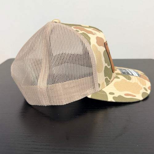 Tan and olive camouflage cap with light tan mesh, side view